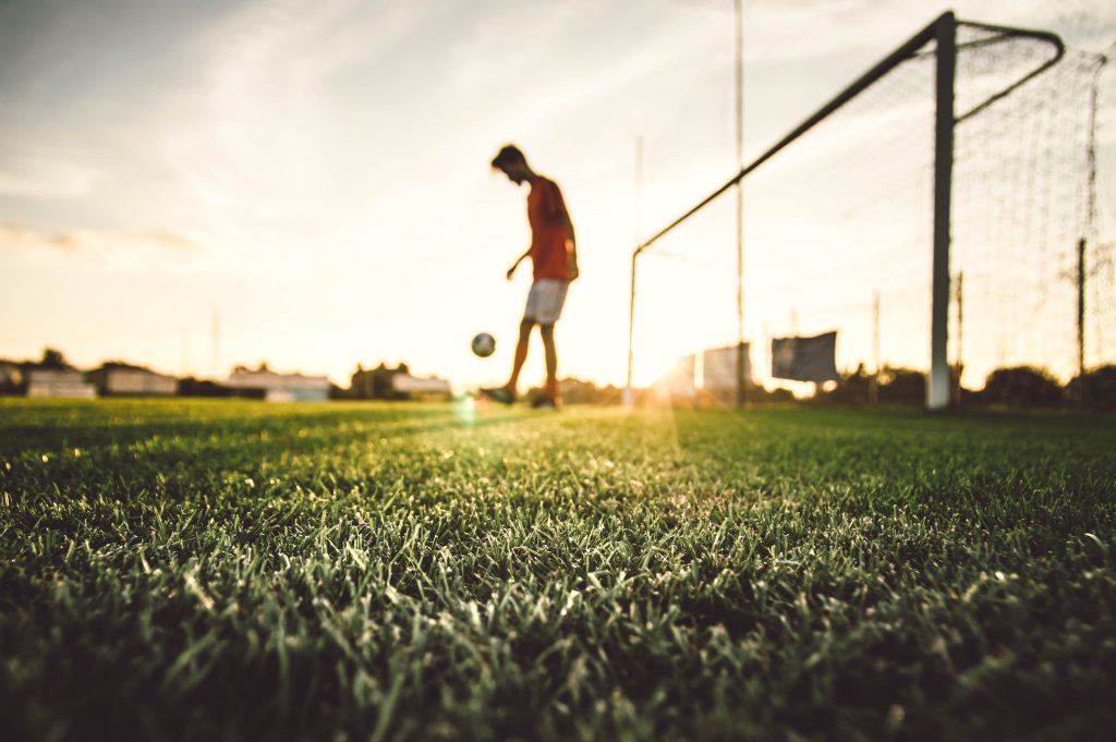 soccer player playing football stadium